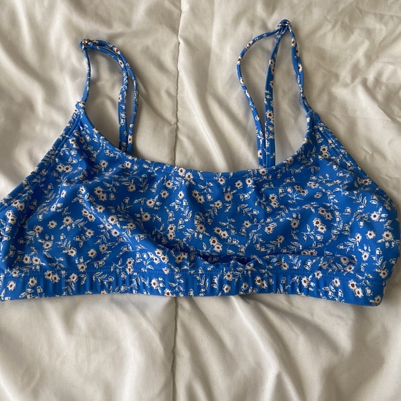 A medium size blue swimsuit with floral design. - Picture 2 of 7
